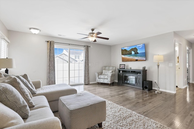 4712 Shalers Dr Unit 54A, Columbus, OH 43228 - living room featuring wood finished floors, ceiling fan, and baseboards