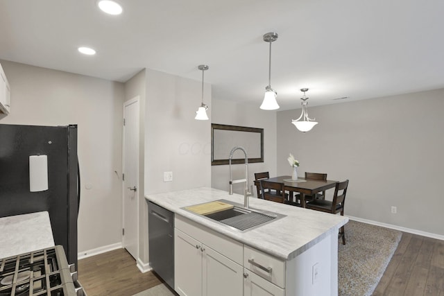 4712 Shalers Dr Unit 54A, Columbus, OH 43228 - kitchen featuring stainless steel dishwasher, a sink, freestanding refrigerator, a peninsula, and dark wood-style floors
