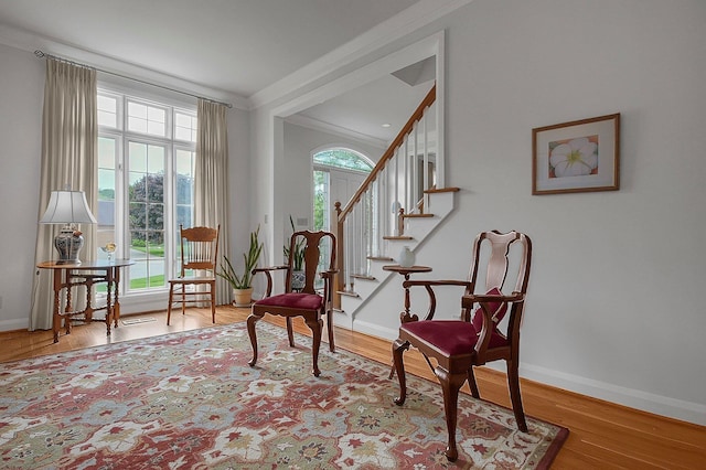 8259 Spruce Needle Ct, Columbus, OH 43235 - sitting room with ornamental molding, baseboards, stairs, and wood finished floors