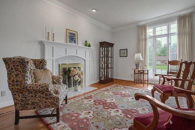 8259 Spruce Needle Ct, Columbus, OH 43235 - sitting room featuring crown molding, wood finished floors, baseboards, and a premium fireplace