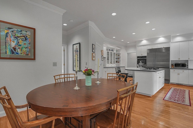 8259 Spruce Needle Ct, Columbus, OH 43235 - dining area with crown molding, light wood-style flooring, recessed lighting, and baseboards
