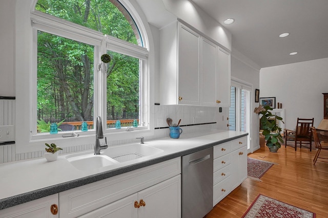 8259 Spruce Needle Ct, Columbus, OH 43235 - kitchen with dishwasher, a sink, plenty of natural light, white cabinetry, and recessed lighting