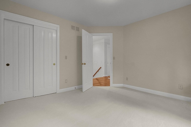 8259 Spruce Needle Ct, Columbus, OH 43235 - unfurnished bedroom with light colored carpet, a closet, and baseboards