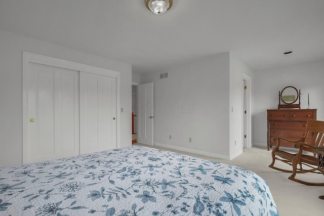 8259 Spruce Needle Ct, Columbus, OH 43235 - bedroom featuring light carpet, a closet, and baseboards