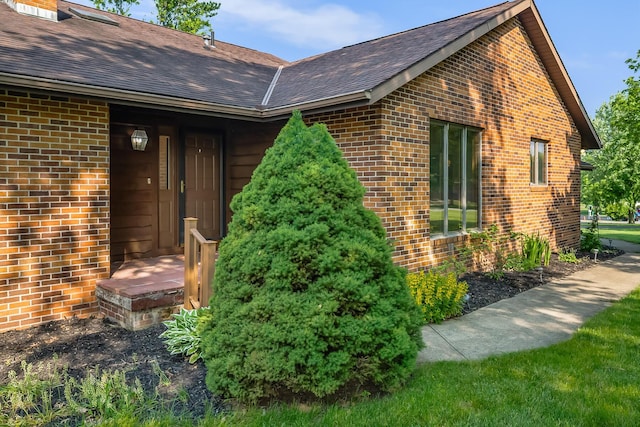 12502 Barbara Dr, Kenton, OH 43326 - doorway to property with brick siding and a shingled roof