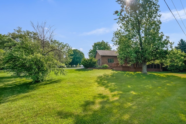 12502 Barbara Dr, Kenton, OH 43326 - view of green lawn with a deck