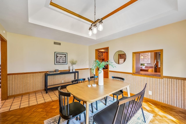 12502 Barbara Dr, Kenton, OH 43326 - dining space featuring a tray ceiling and wainscoting