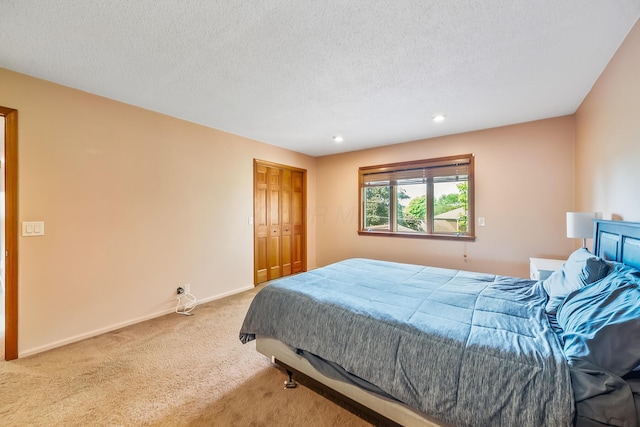 12502 Barbara Dr, Kenton, OH 43326 - carpeted bedroom featuring a textured ceiling, recessed lighting, baseboards, and a closet