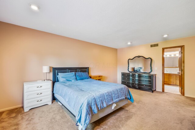 12502 Barbara Dr, Kenton, OH 43326 - bedroom with light carpet, baseboards, recessed lighting, and ensuite bath