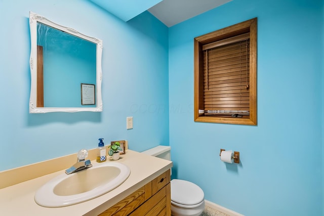 12502 Barbara Dr, Kenton, OH 43326 - half bathroom featuring toilet and vanity