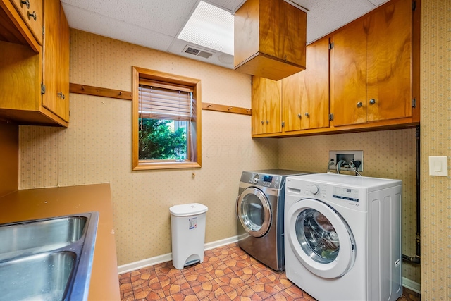 12502 Barbara Dr, Kenton, OH 43326 - laundry room with washing machine and dryer, cabinet space, and baseboards