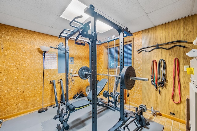 12502 Barbara Dr, Kenton, OH 43326 - exercise area featuring a paneled ceiling, wallpapered walls, and baseboards