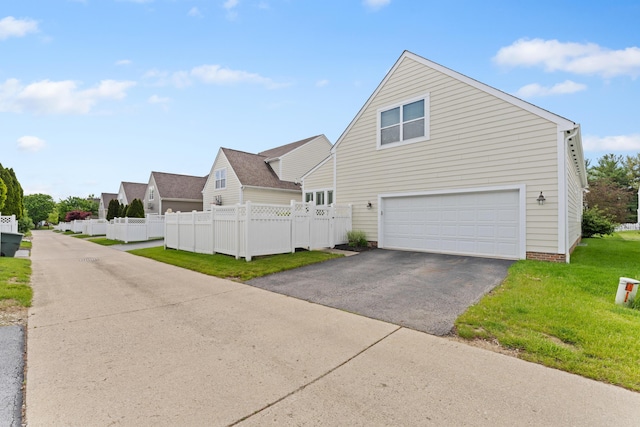 traditional home with driveway and an attached garage