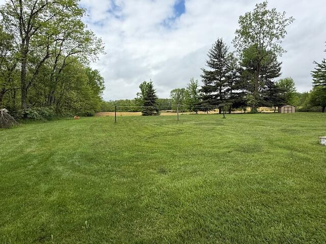 2802 County Road 26, Marengo, OH 43334 - view of green lawn featuring a storage unit and an outdoor structure