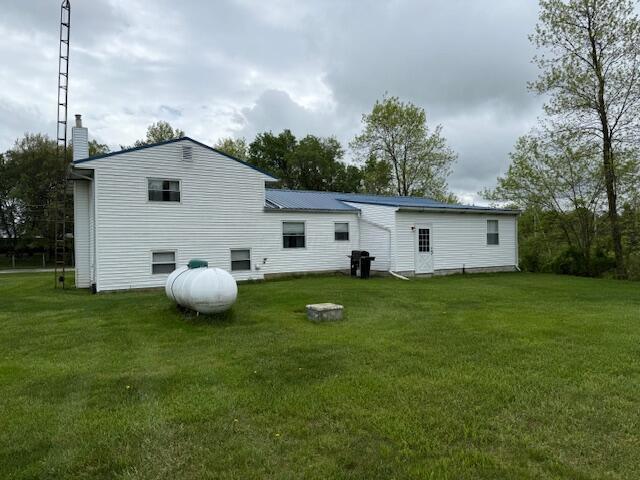 2802 County Road 26, Marengo, OH 43334 - rear view of house featuring a lawn and a chimney