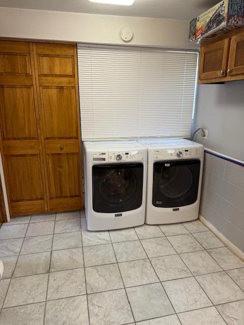 2802 County Road 26, Marengo, OH 43334 - laundry area with cabinet space, washer and dryer, and light tile patterned flooring