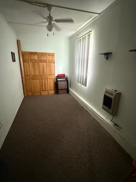 2802 County Road 26, Marengo, OH 43334 - unfurnished bedroom with carpet flooring, heating unit, baseboards, and a ceiling fan
