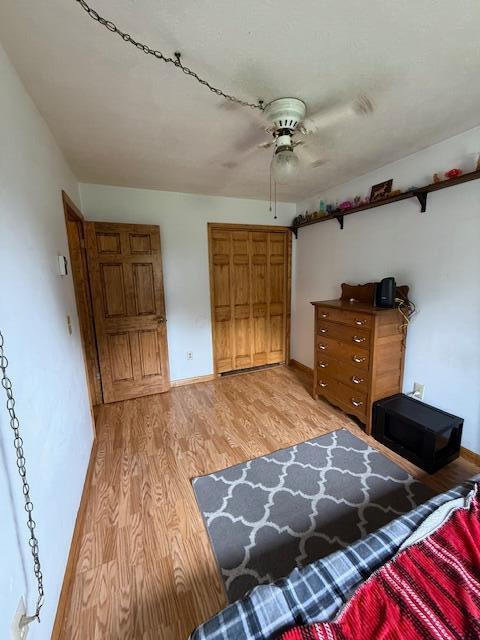 2802 County Road 26, Marengo, OH 43334 - bedroom with light wood-type flooring, baseboards, and a ceiling fan