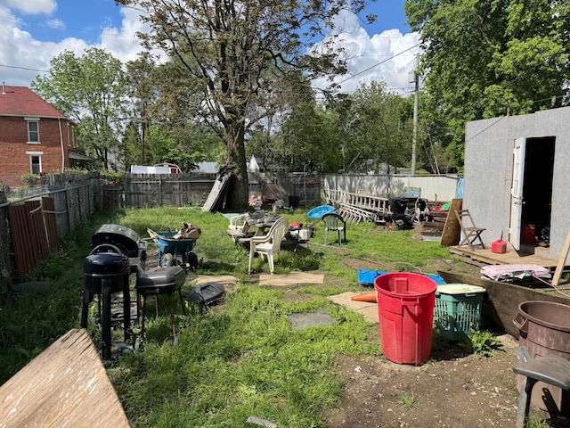 870-872 Sullivant Ave, Columbus, OH 43223 - fenced backyard with a storage unit and an outbuilding