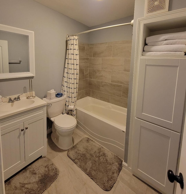 220 E Tompkins St, Columbus, OH 43202 - bathroom with toilet, shower / bath combo with shower curtain, and vanity