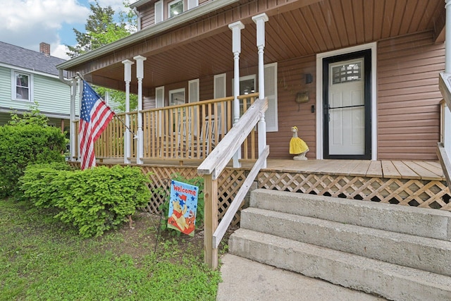 doorway to property with a porch