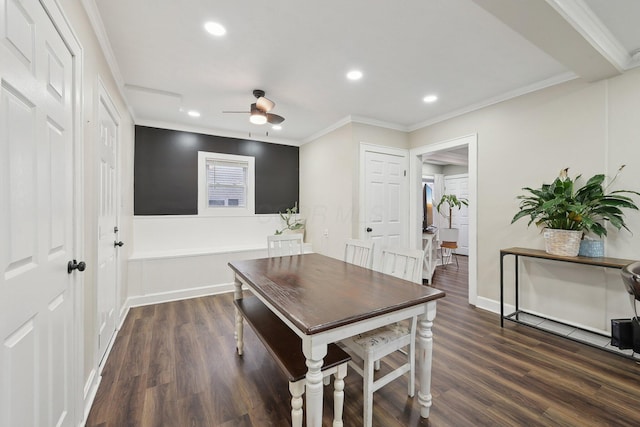 dining area featuring dark wood-style flooring, a ceiling fan, recessed lighting, crown molding, and baseboards