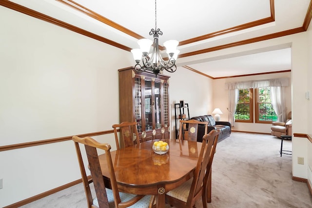 dining area featuring a chandelier, light colored carpet, crown molding, and baseboards