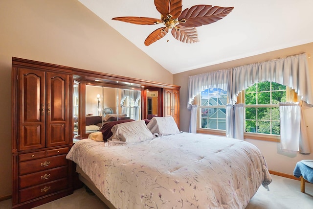 bedroom with light colored carpet, high vaulted ceiling, baseboards, and a ceiling fan