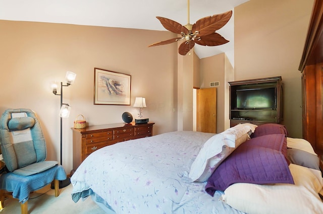 bedroom featuring light carpet, lofted ceiling, and a ceiling fan