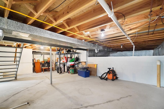 unfinished basement with concrete block wall