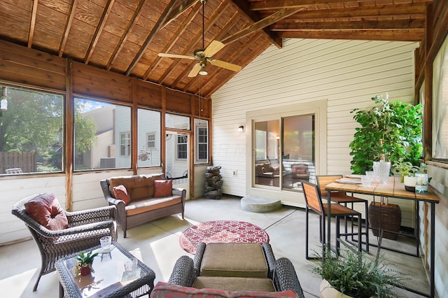 sunroom with ceiling fan, outdoor lounge area, and vaulted ceiling