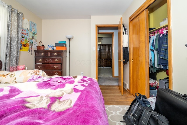 1469 Sandalwood Pl, Columbus, OH 43229 - bedroom with a closet, wood finished floors, and a spacious closet