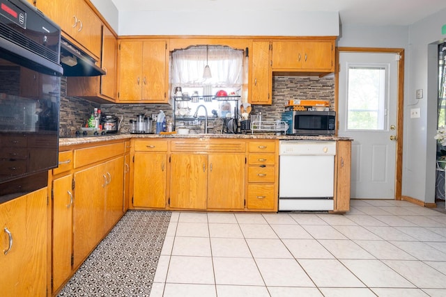 1469 Sandalwood Pl, Columbus, OH 43229 - kitchen with black appliances, a sink, range hood, decorative backsplash, and brown cabinets