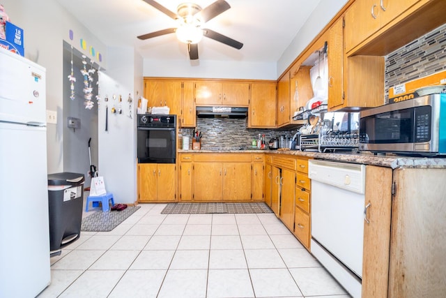 1469 Sandalwood Pl, Columbus, OH 43229 - kitchen with white appliances, backsplash, a ceiling fan, and under cabinet range hood