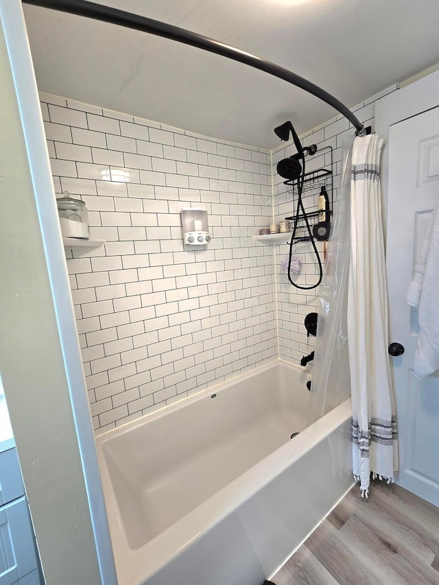 690 E Kossuth St, Columbus, OH 43206 - bathroom with wood finished floors and shower / bath combo