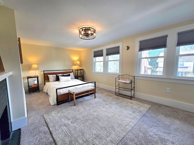 690 E Kossuth St, Columbus, OH 43206 - bedroom featuring carpet, baseboards, and a fireplace with flush hearth