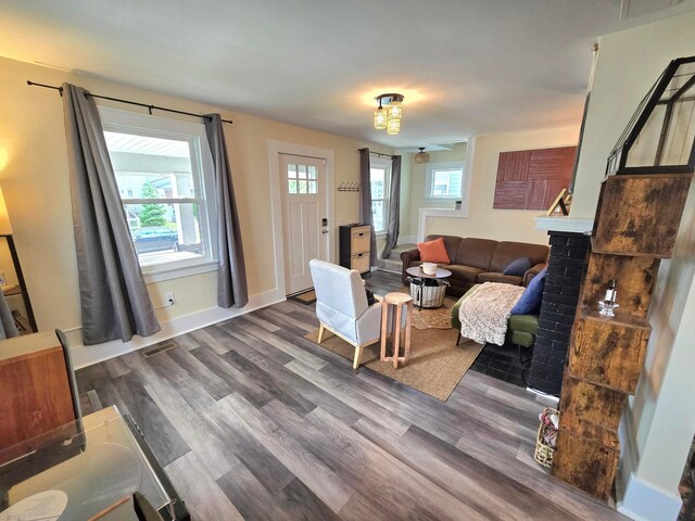 690 E Kossuth St, Columbus, OH 43206 - living room with dark wood-style floors and baseboards