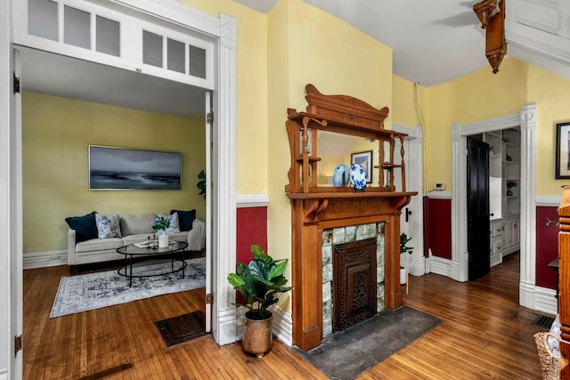 1042 Neil Ave, Columbus, OH 43201 - entryway featuring a tiled fireplace, wood finished floors, and baseboards
