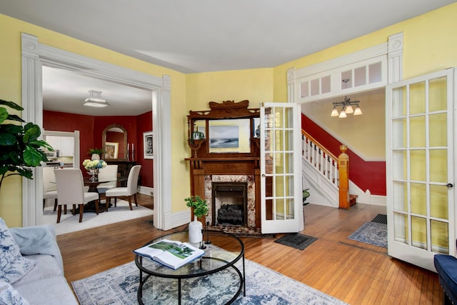 1042 Neil Ave, Columbus, OH 43201 - living area with stairway, wood finished floors, and baseboards