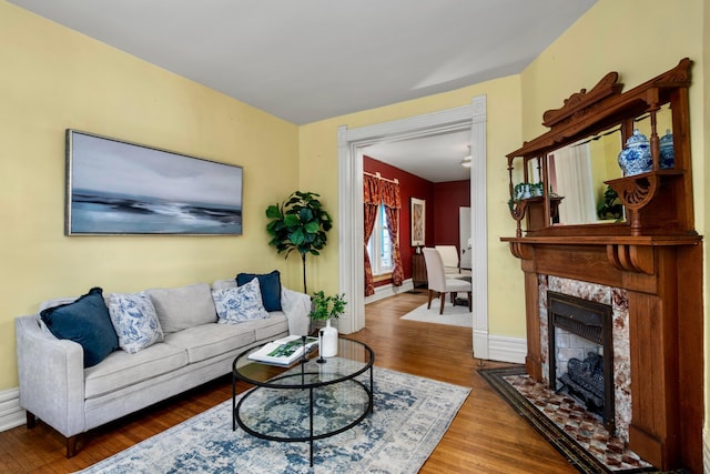 1042 Neil Ave, Columbus, OH 43201 - living area featuring wood finished floors, a fireplace, and baseboards