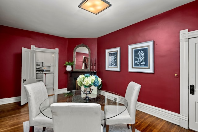 1042 Neil Ave, Columbus, OH 43201 - dining space featuring baseboards and wood finished floors