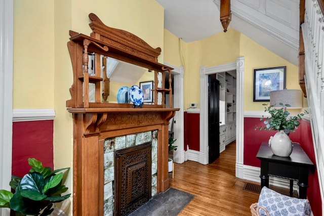 1042 Neil Ave, Columbus, OH 43201 - foyer entrance featuring wood finished floors, a high end fireplace, and baseboards