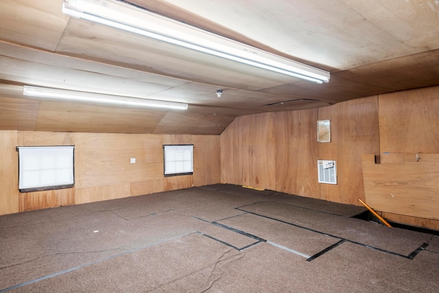 1042 Neil Ave, Columbus, OH 43201 - additional living space featuring carpet flooring, wooden walls, and vaulted ceiling