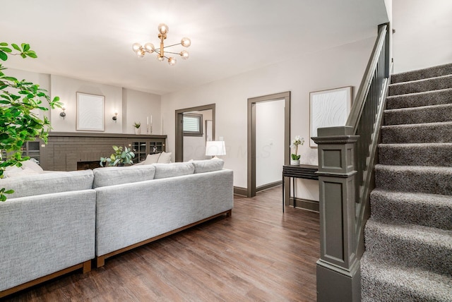 46 E Markison Ave, Columbus, OH 43207 - living room with stairway, wood finished floors, and a chandelier