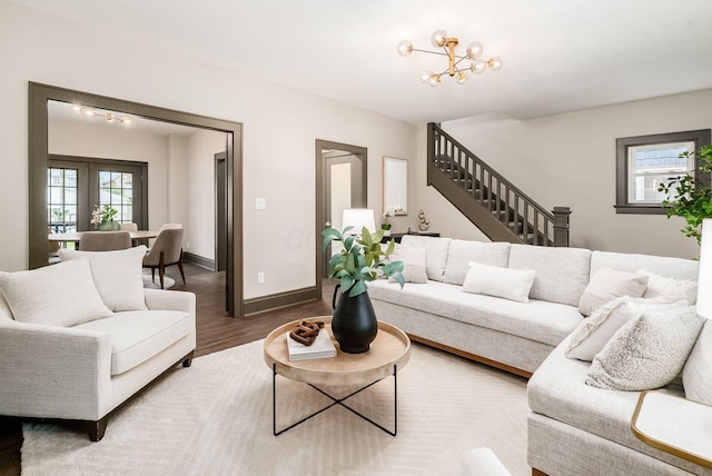 46 E Markison Ave, Columbus, OH 43207 - living area featuring stairs, plenty of natural light, wood finished floors, and baseboards