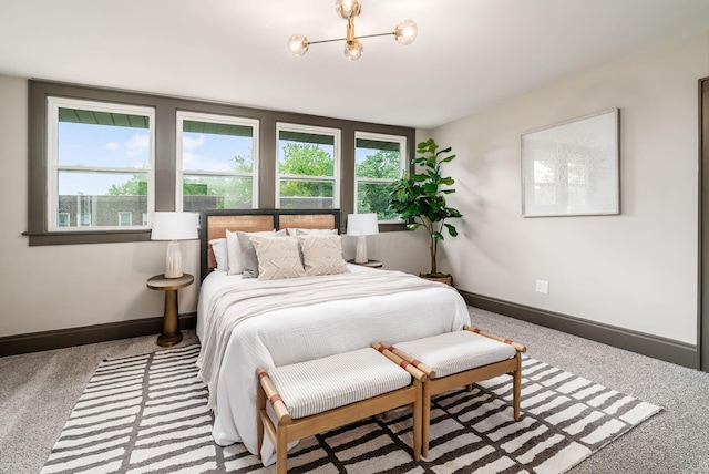 46 E Markison Ave, Columbus, OH 43207 - carpeted bedroom with a chandelier and baseboards
