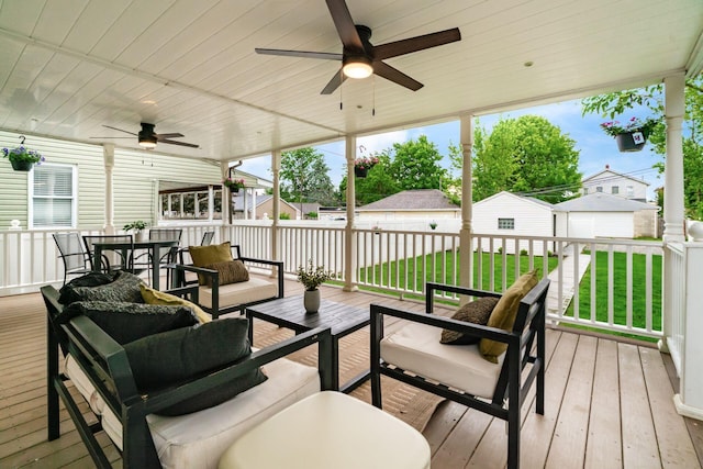 46 E Markison Ave, Columbus, OH 43207 - deck with an outdoor hangout area, ceiling fan, outdoor dining space, a yard, and an outbuilding