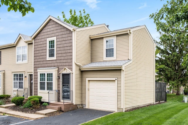 5120 Singleton Dr Unit 36D, Hilliard, OH 43026 - townhome / multi-family property featuring a garage, a front lawn, and asphalt driveway