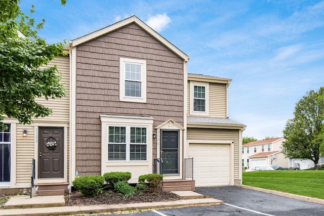 5120 Singleton Dr Unit 36D, Hilliard, OH 43026 - multi unit property featuring entry steps, an attached garage, driveway, and a front yard