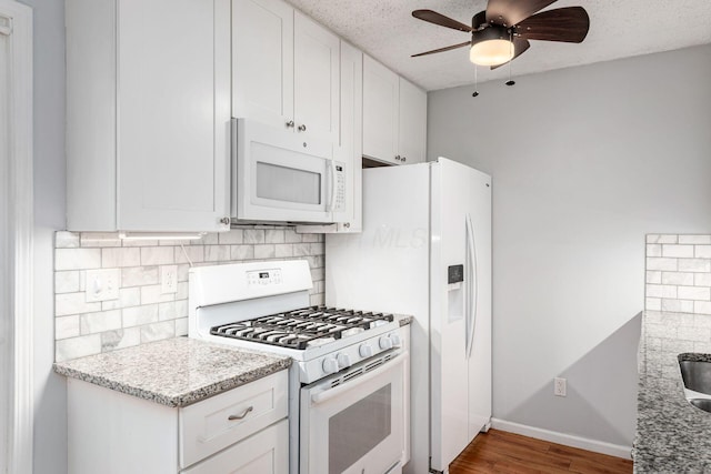5120 Singleton Dr Unit 36D, Hilliard, OH 43026 - kitchen featuring white appliances, backsplash, a ceiling fan, white cabinetry, and a textured ceiling
